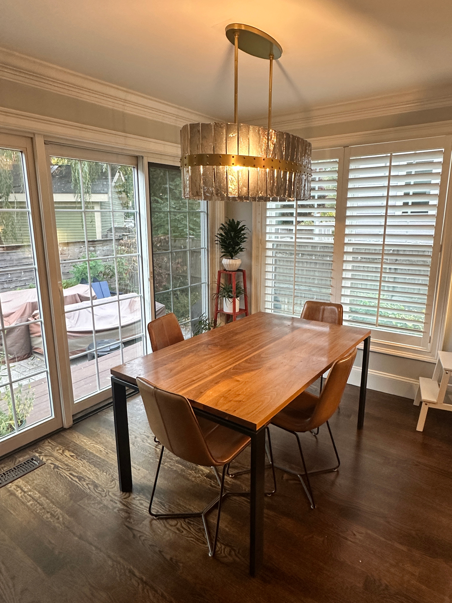 Decorative pendant chandelier installed over dining room table