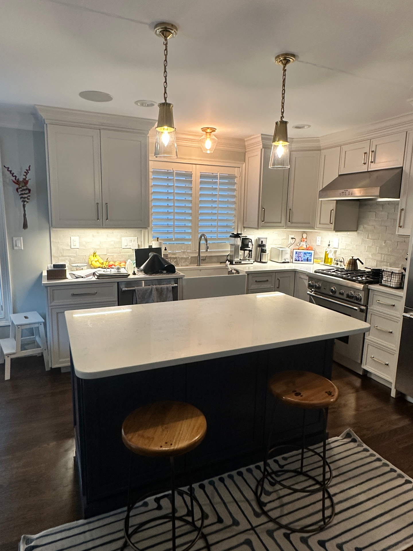 Kitchen island with twin glass pendant lights
